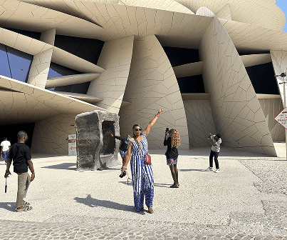 Associate in Qatar at museum exterior